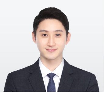 340x330_장재익 Professional headshot of a smiling man in a dark suit and blue tie against a light gray background.