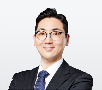 340x330_최정우 Professional headshot of a smiling man in a dark suit and glasses, suitable for a business profile.